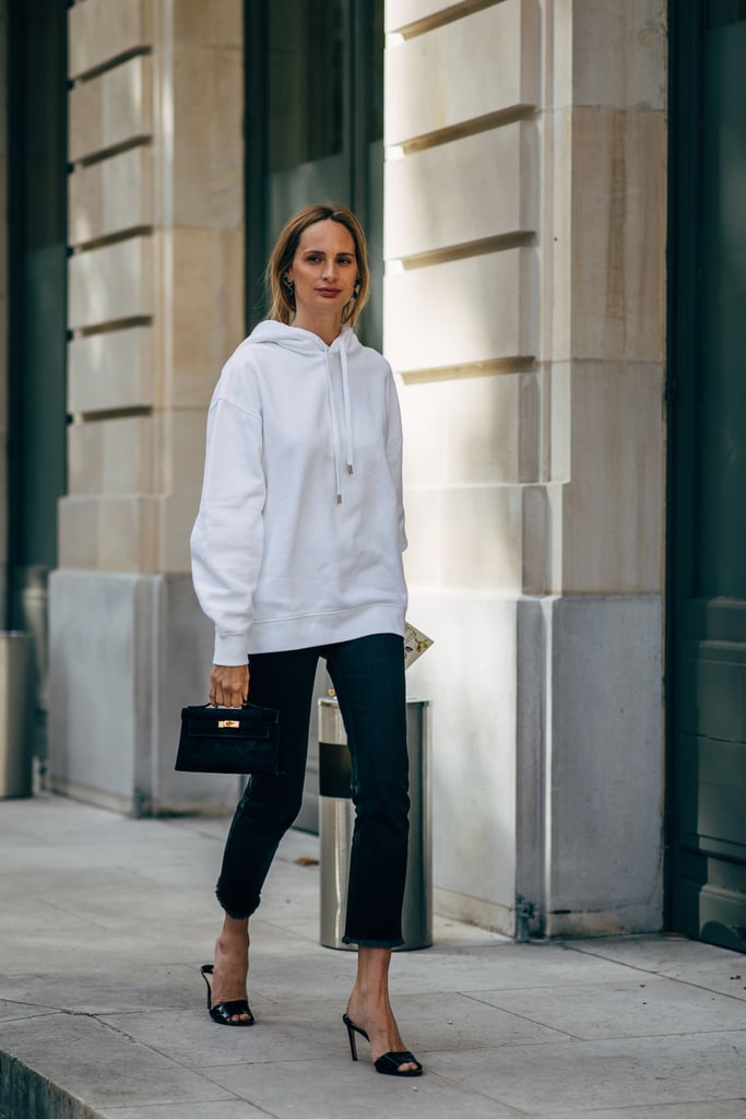 Yes, you can wear heels with a hoodie, and the effect is utterly chic.
