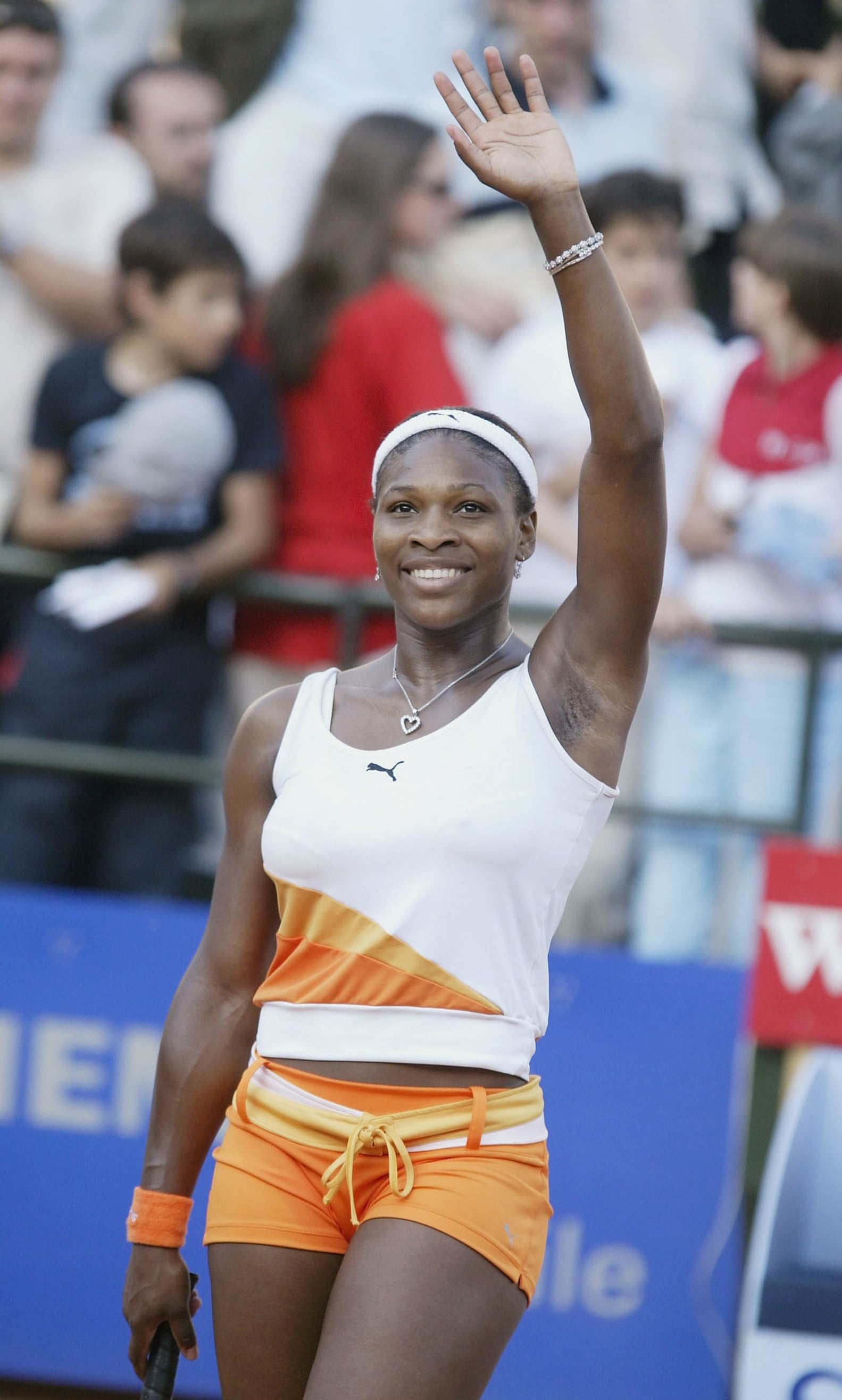 Serena Williams at Italia Masters 2003 — orange and white Puma outfit