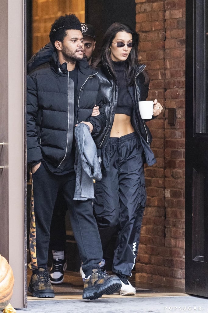Bella Hadid Wearing a Crop Top and Puffer With The Weeknd