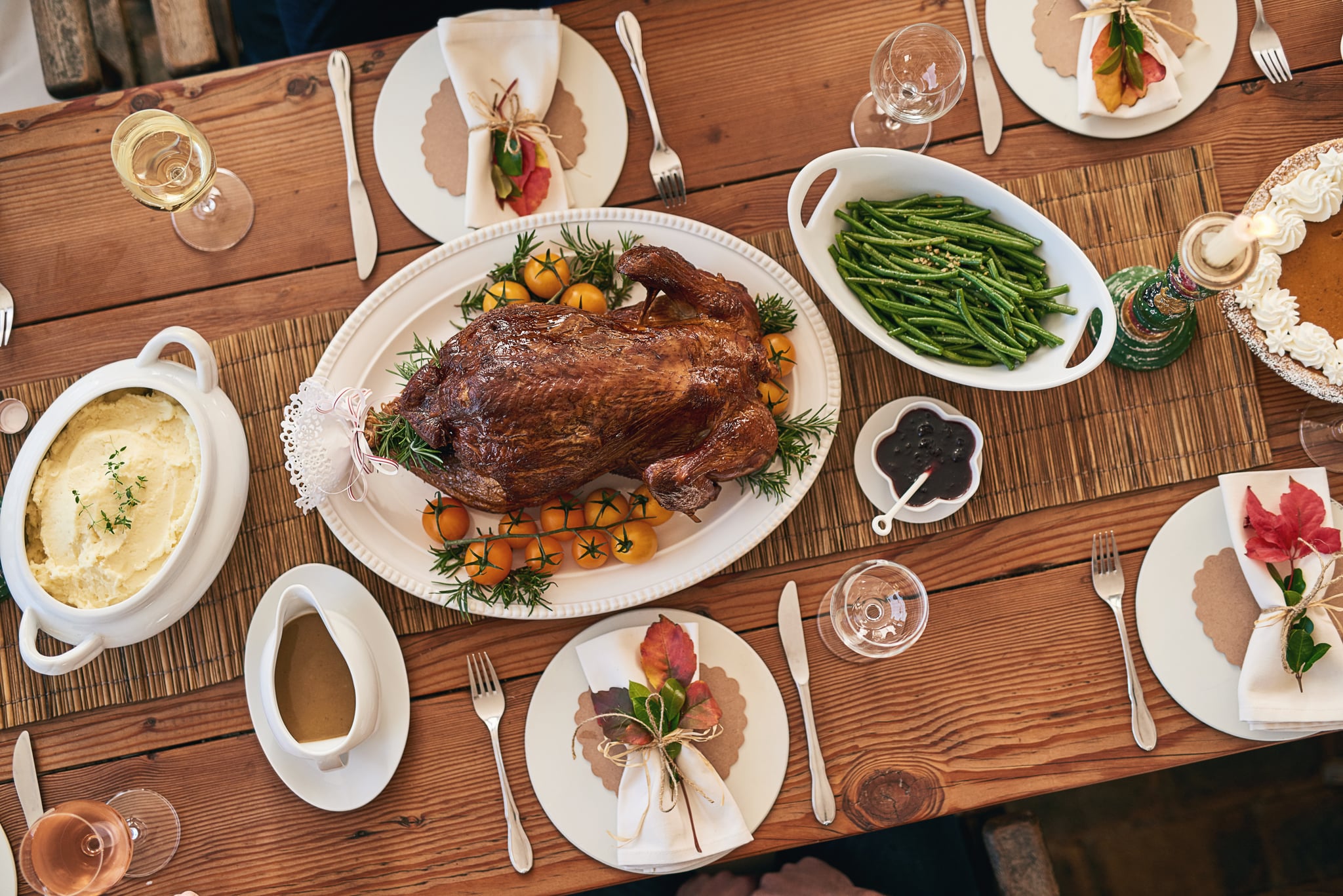 Shot nicely set table with all kinds of food on it for a lunch party