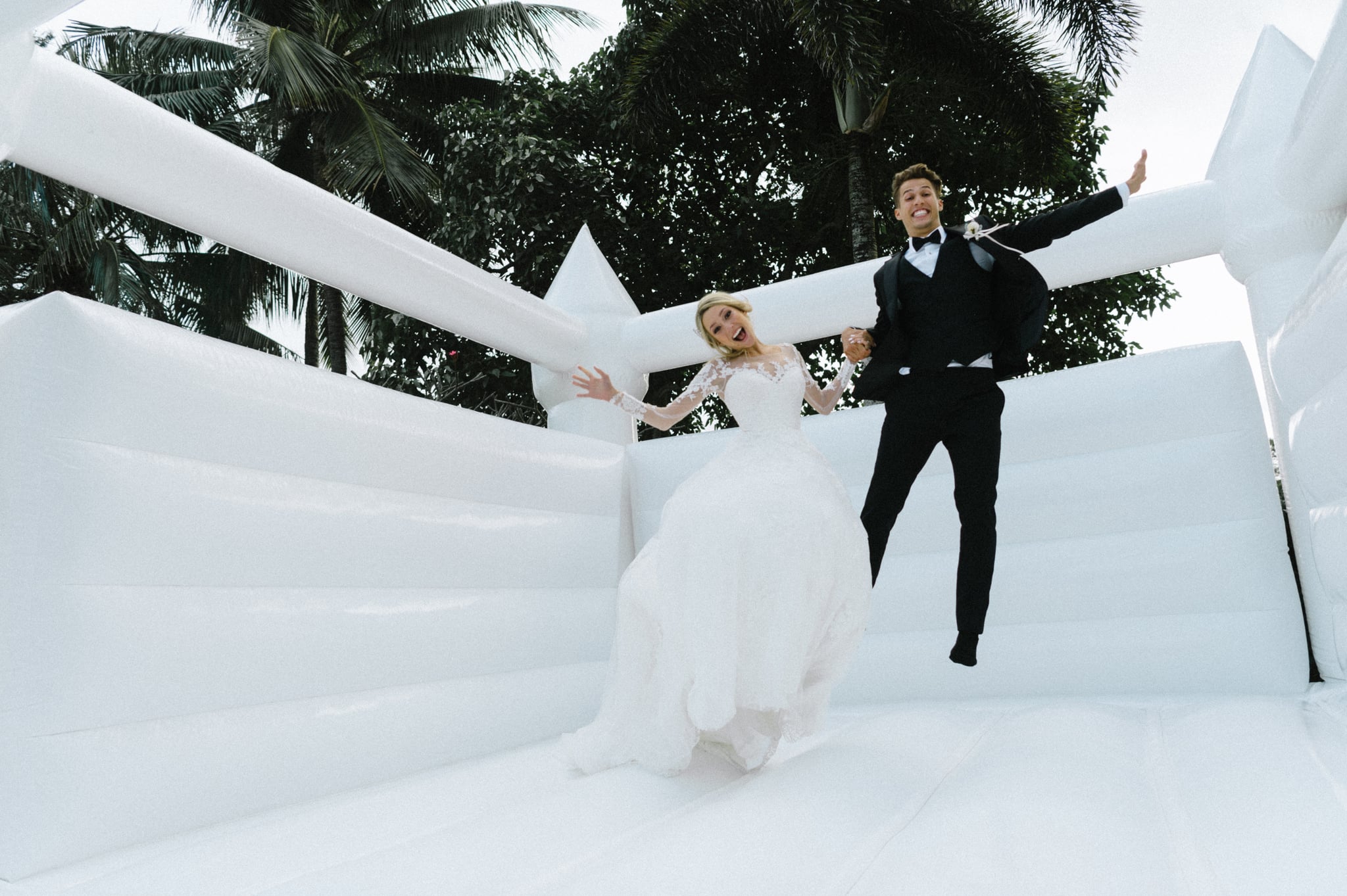 Couple-Takes-Wedding-Photos-Bouncy-Castl