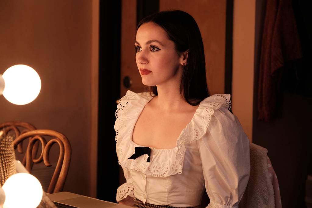 During her play, Lexi commanded attention in a white blouse featuring puff sleeves, a tiny front bow, and Peter Pan collar.