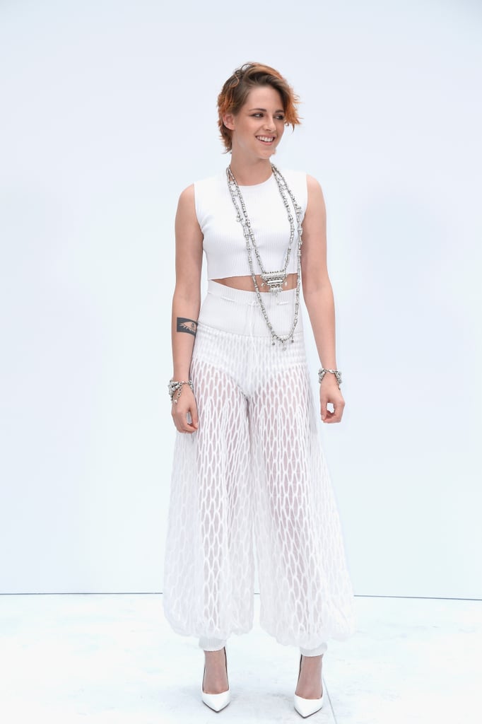 Kristen Stewart made quite an entrance at Haute Couture Fashion Week in Paris on Tuesday. The actress bared her legs in sheer pants and debuted a brand-new bob haircut — see it from all angles! — before sitting front row at the Chanel show. The edgy, Summer-ready look is just her latest transformation, though throughout the past few months Kristen has made plenty of big changes for work. She first dyed her hair red in the Spring for her role in American Ultra, and we also saw a new side of Kristen, thanks to photos for her upcoming film Camp X-Ray, which have her in full uniform. More recently, we got a glimpse of Kristen getting stripped down and seductive in Clouds of Sils Maria. To top it all off, she tested out her hand directing a music video for Sage + the Saints in May, proving that she always has another trick up her sleeve.