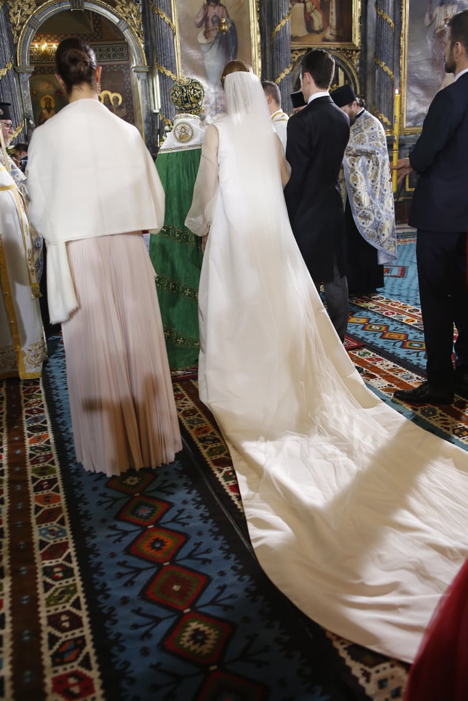 The Train of Her Dress Flowed Behind Her