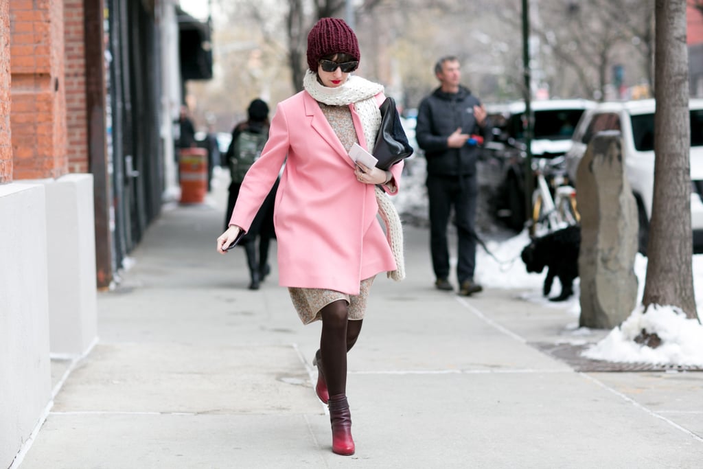 Her pink coat made dashing through the snow look totally cute.