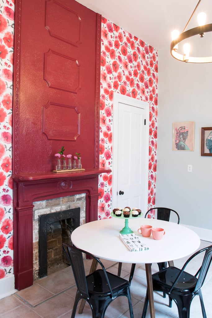 The room's tall ceilings were masked by its flat white walls, so Monica drew the eye up by filling the space above the fireplace with ornate molding. And to make it even more of a focal point, she covered the entire stretch from the fireplace up in bold Raddichio Leaf paint.