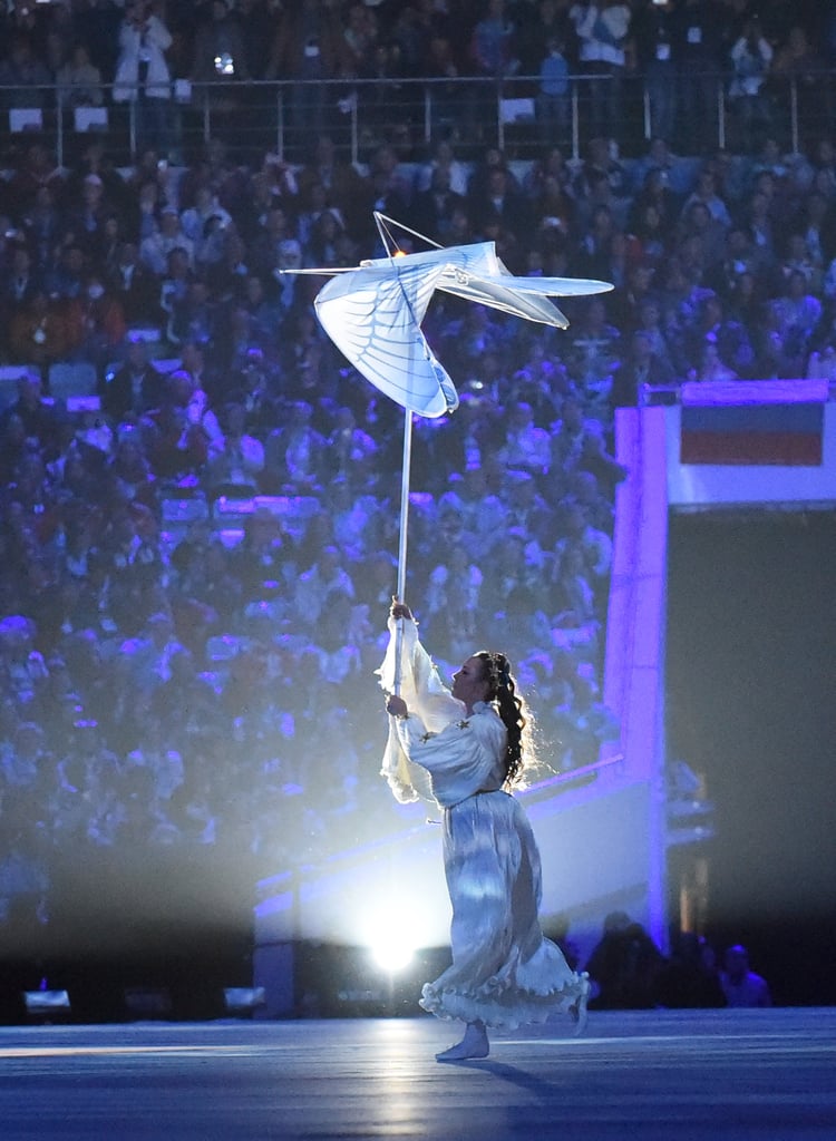 A dancer held up the white bird as she performed.