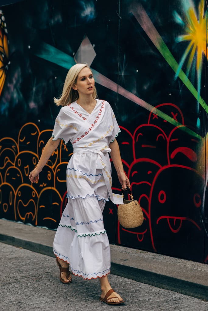 Sometimes a caftan wrap dress looks best accessorized with vacation essentials like a woven bag and natural flats.