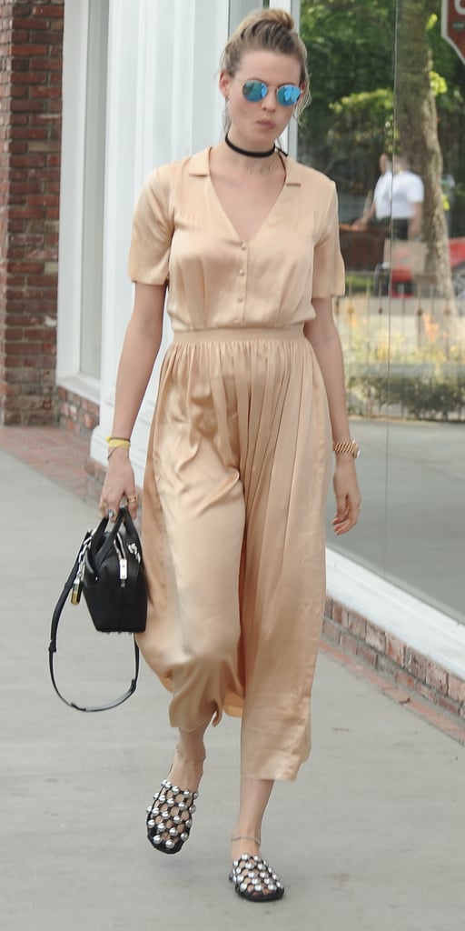 For an afternoon out in Los Angeles, Behati wore a loose silk dress.