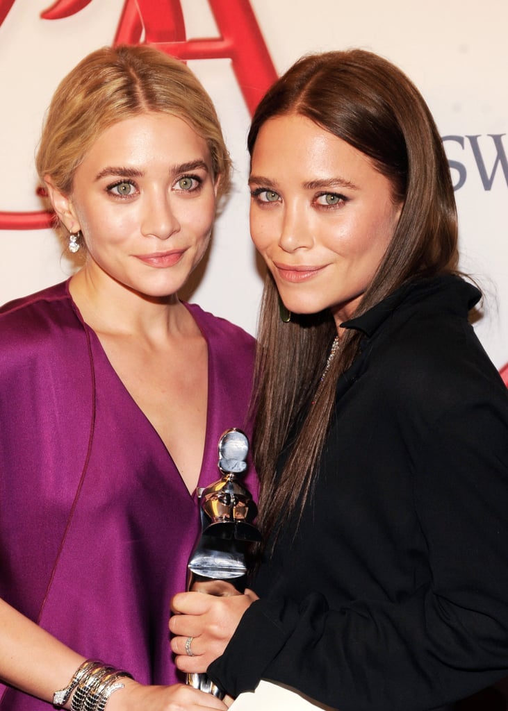 By the 2012 CFDA Awards, Mary-Kate was back to darkened hair. This time she went for a straightened look, while Ashley went for a textured updo.