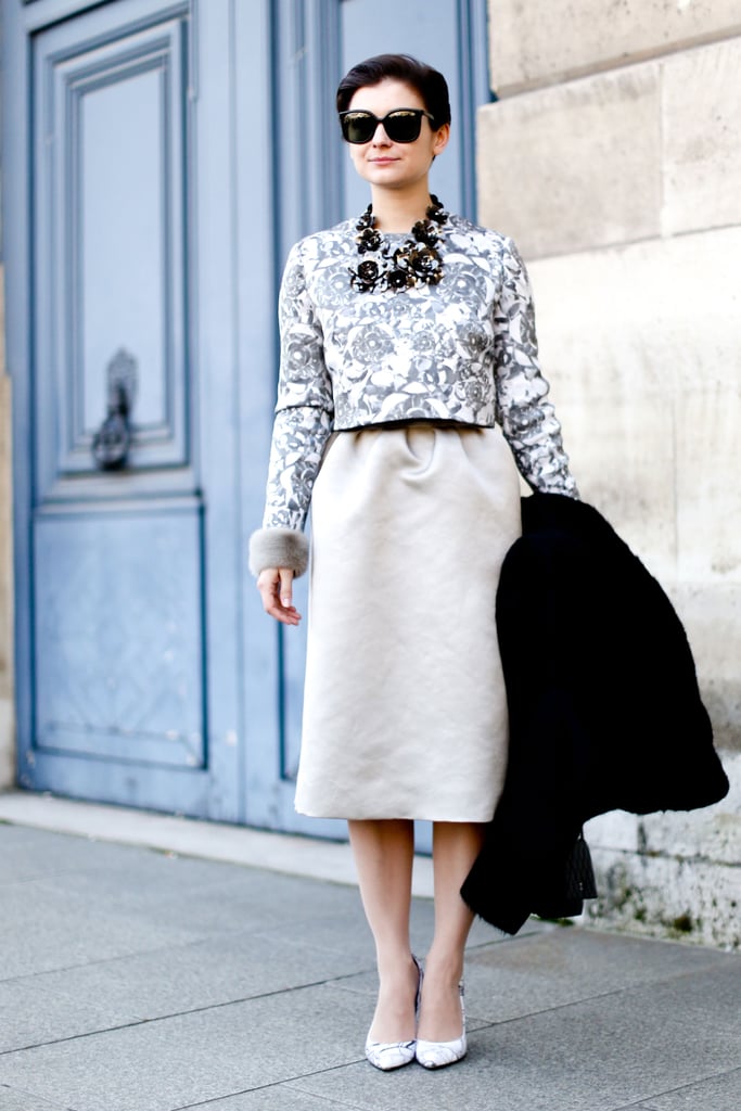 We love that this showgoer echoed the floral print of her blouse with a statement necklace.
We love that this showgoer echoed the floral print of her blouse with a statement necklace.