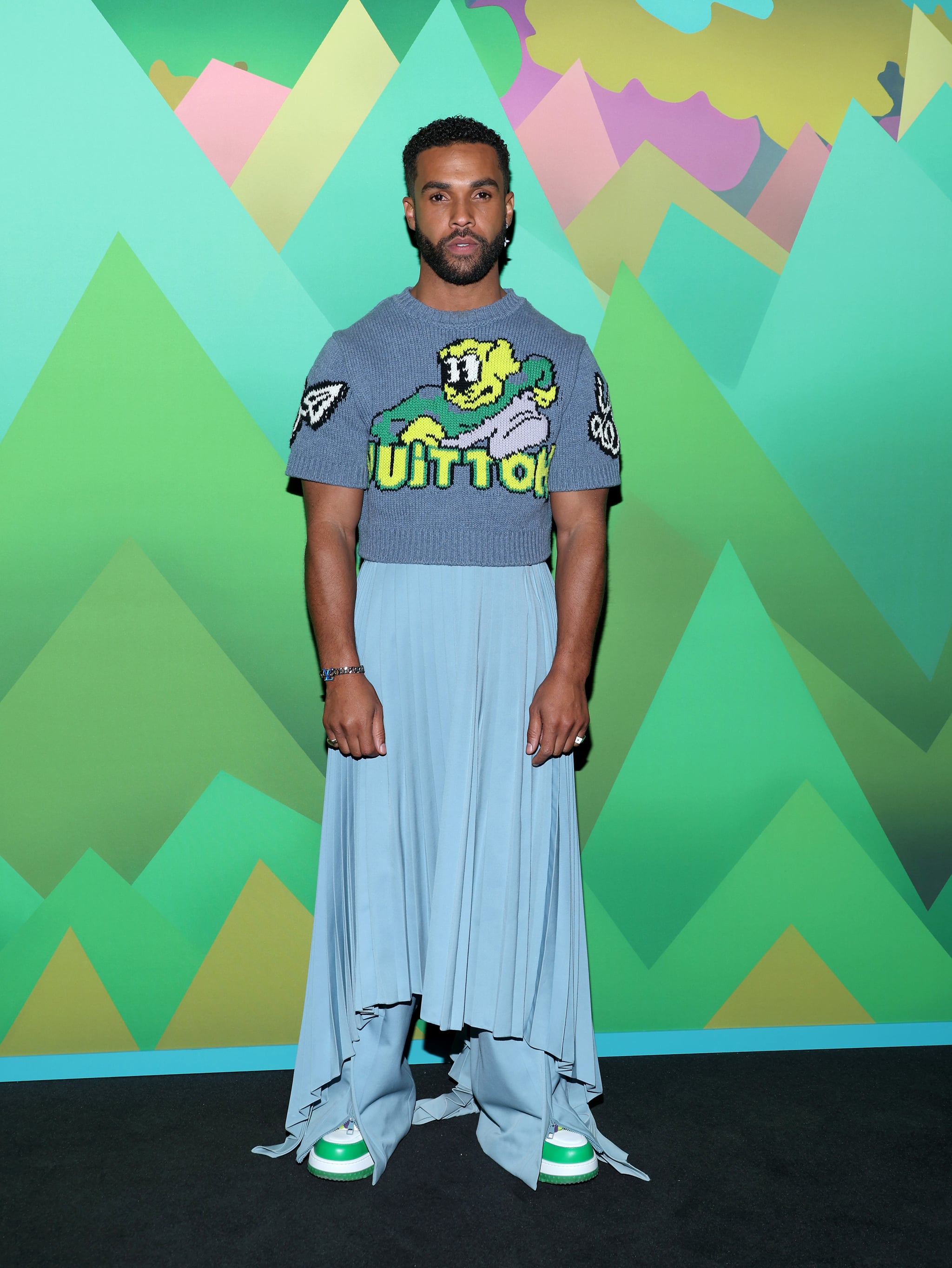 Lucien Laviscount Attends the Louis Vuitton AW23 Menswear Show at Paris  Fashion Week, Emily in Paris's Lucien Laviscount Rocks a Pleated Skirt  at Louis Vuitton Show