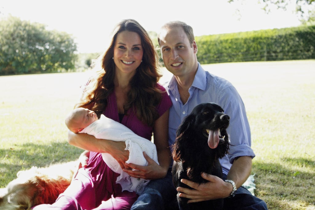 Kate, William, and George took one of their first family photos in August 2013 with Lupo and the Middletons' golden retriever, Tilly.