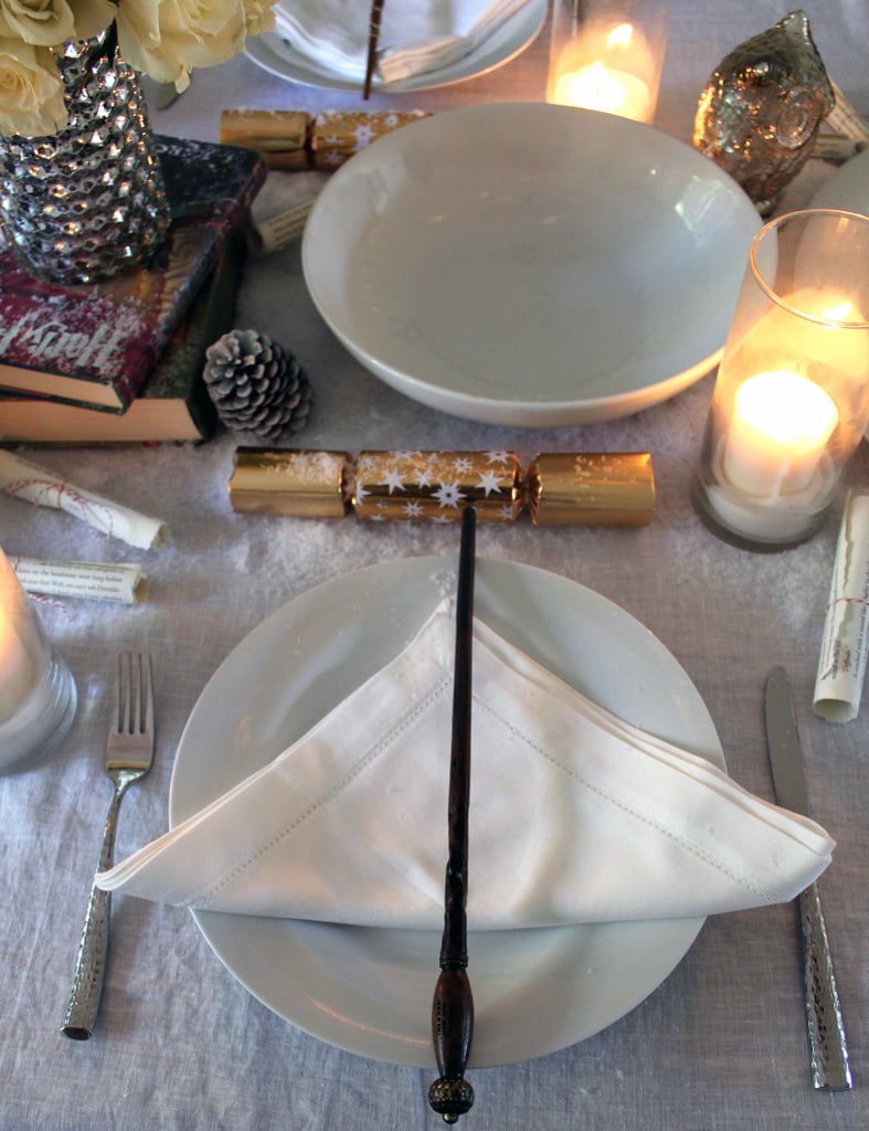 Wow guests with a table setting that resembles the Deathly Hallows symbol complete with a wand.