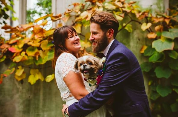 This adorable couple is seriously all smiles with their pooch!