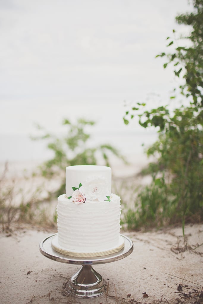 This two-layered ruffle and floral cake is effortless and elegant all at once; consider it a great option for beach weddings and beyond.