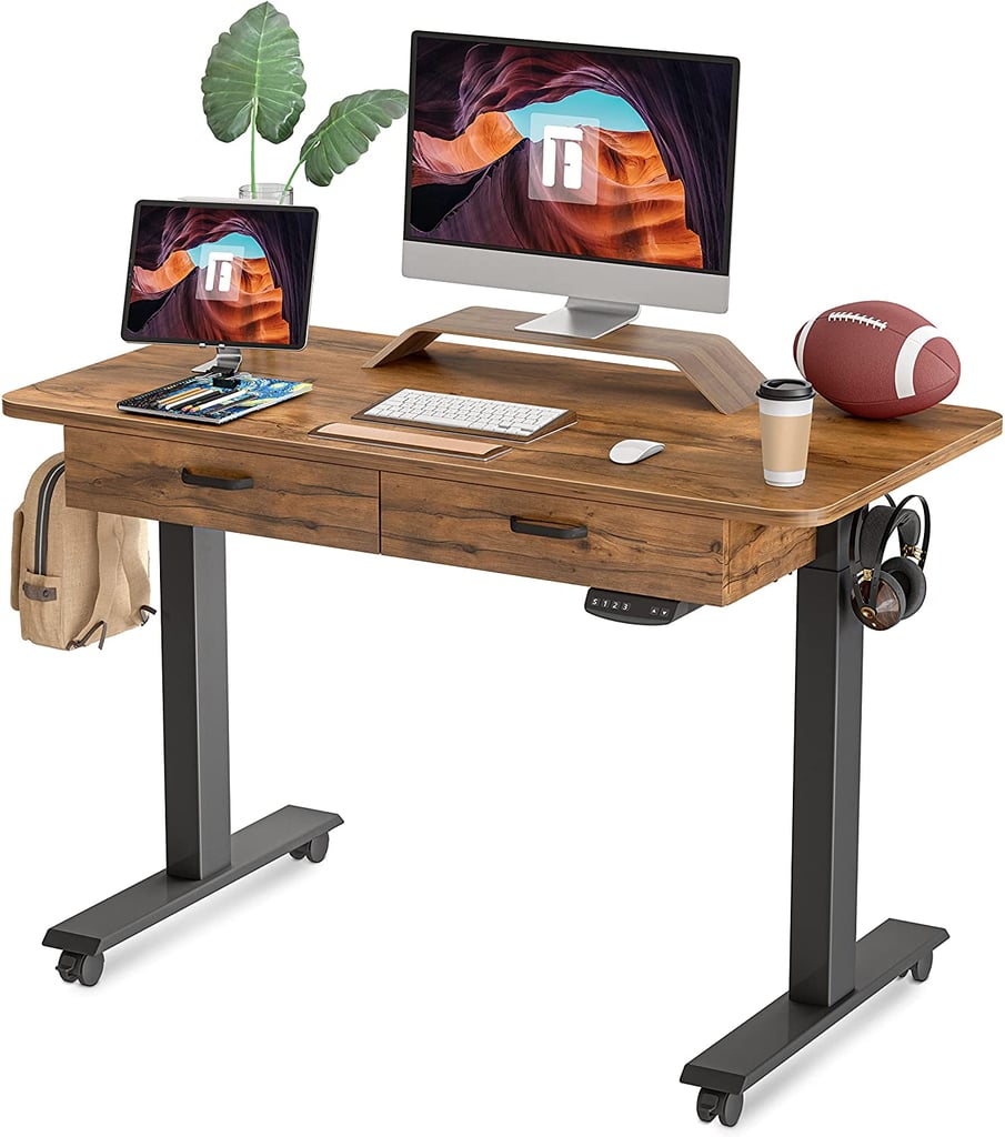 A Standing Desk: Fezibo Adjustable Height Electric Standing Desk With Double Drawers