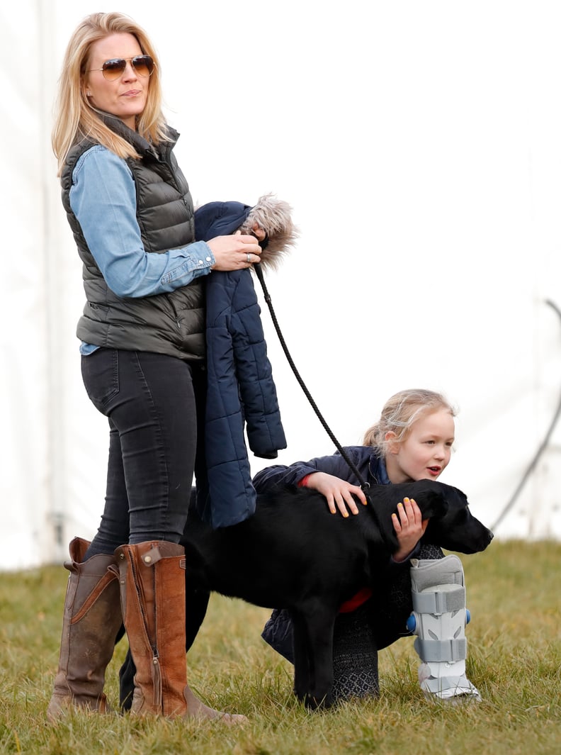 Autumn and Savannah Phillips With the Family's Black Lab