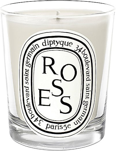 "Again with the rose…told you I am a rose-scent junkie. Candles are a great gift for anyone on your list. I love Diptyque because they look chic and cool on display, but also fill your house with beautiful scents and gives a sort of nostalgia. " 
 Diptyque Rose Scented Candle ($62)