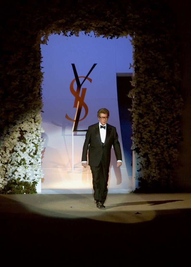 Yves Saint Laurent walked down the catwalk to salute the crowd after his last-ever haute couture show in 2002.
Yves Saint Laurent walked down the catwalk to salute the crowd after his last-ever haute couture show in 2002.