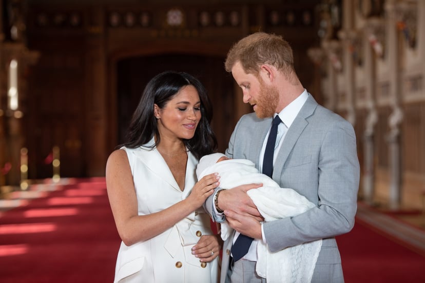 WINDSOR, ENGLAND - MAY 08: Prince Harry, Duke of Sussex and Meghan, Duchess of Sussex, pose with their newborn son Prince Archie Harrison Mountbatten-Windsor during a photocall in St George's Hall at Windsor Castle on May 8, 2019 in Windsor, England. The 