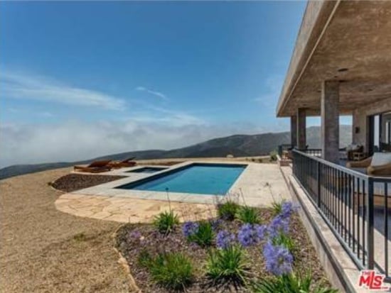 The 3,500-square-foot home includes a covered patio, pool, spa, and a downstairs area that could be used as gym by the gold medal winner.