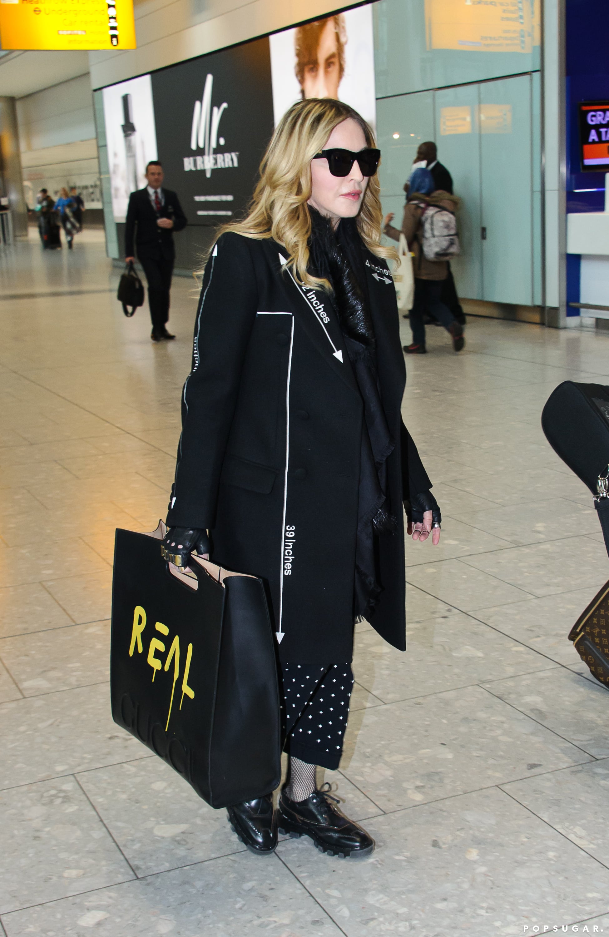 Madonna-Carrying-Her-Gucci-Bag-Through-A