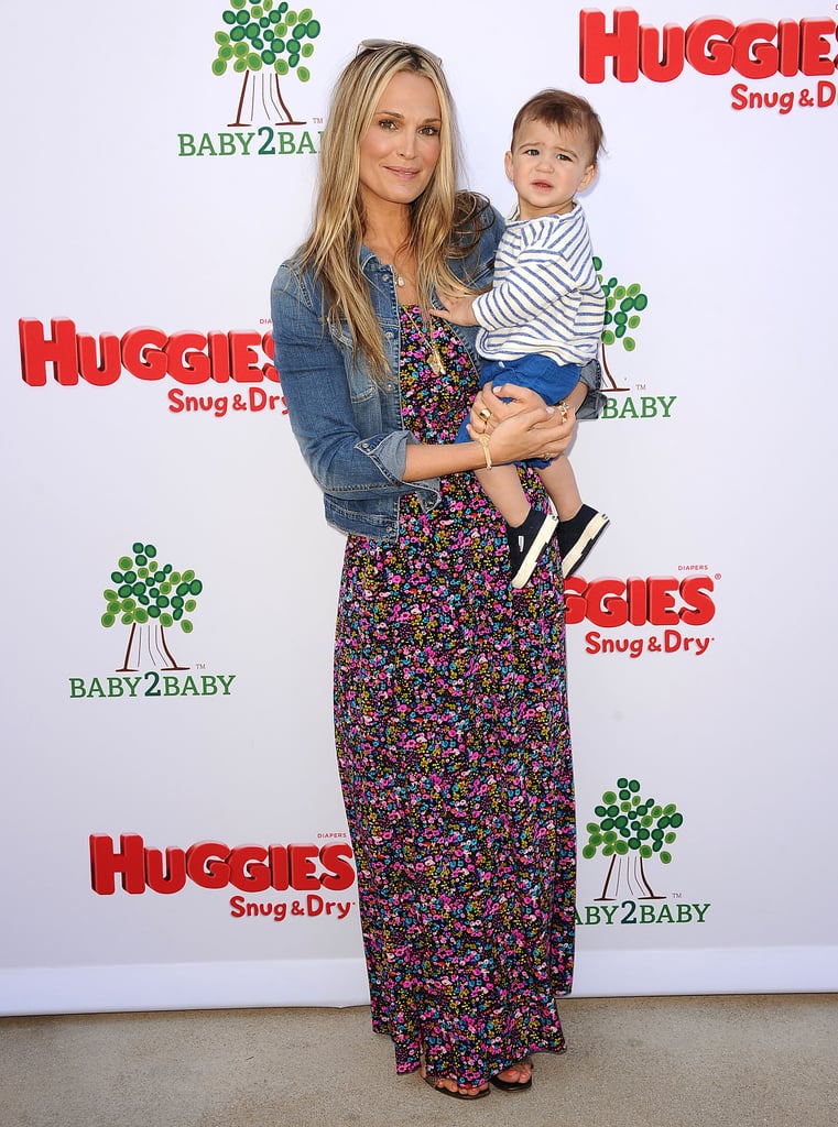 Molly Sims tempered her busy floral maxi dress with a denim jacket at a Baby2Baby event in LA.