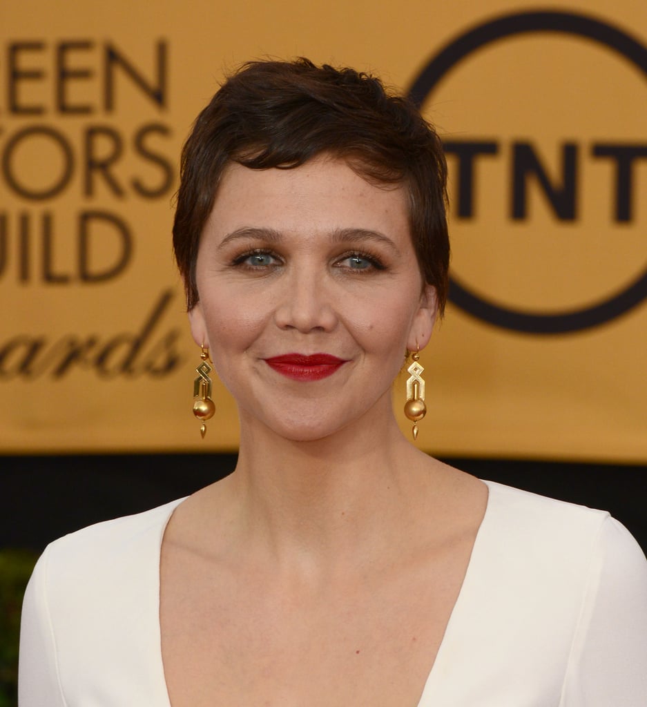 Maggie Gyllenhaal's architectural Fred Leighton pendant earrings were the golden touch to her all-white look.