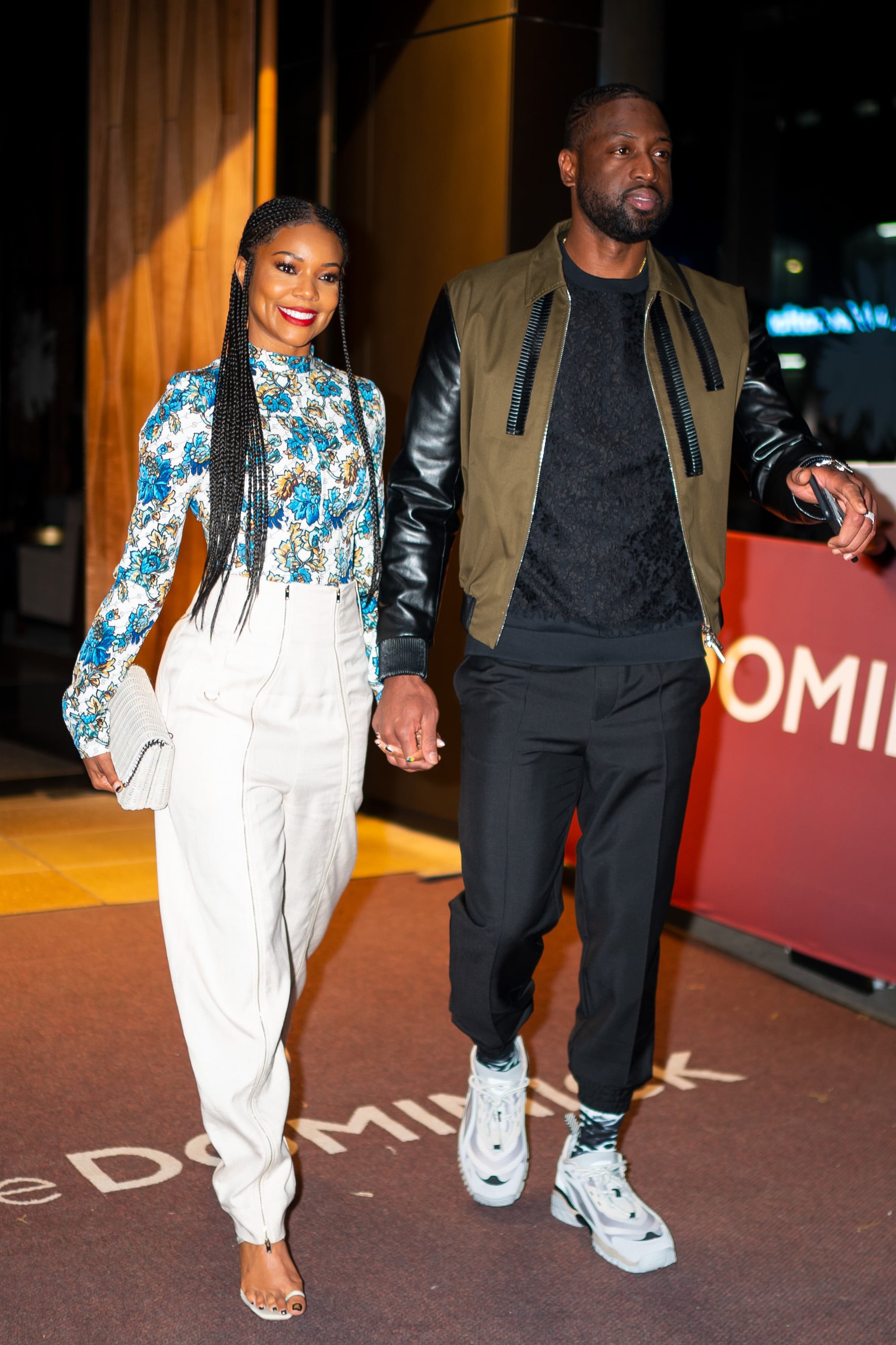 Floral Shirt and White Pants | 20 Lessons We Can Take From Gabrielle  Union's Unbeatable Date-Night Style | POPSUGAR Fashion Photo 8