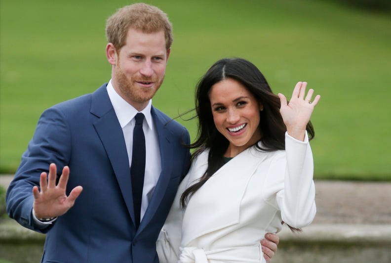 Britain's Prince Harry and his fiancée US actress Meghan Markle pose for a photograph in the Sunken Garden at Kensington Palace in west London on November 27, 2017, following the announcement of their engagement.Britain's Prince Harry will marry his US ac