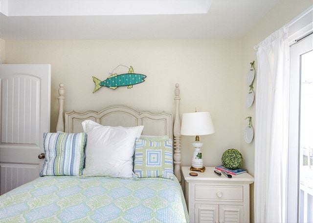 The second bedroom upstairs also has a private balcony.