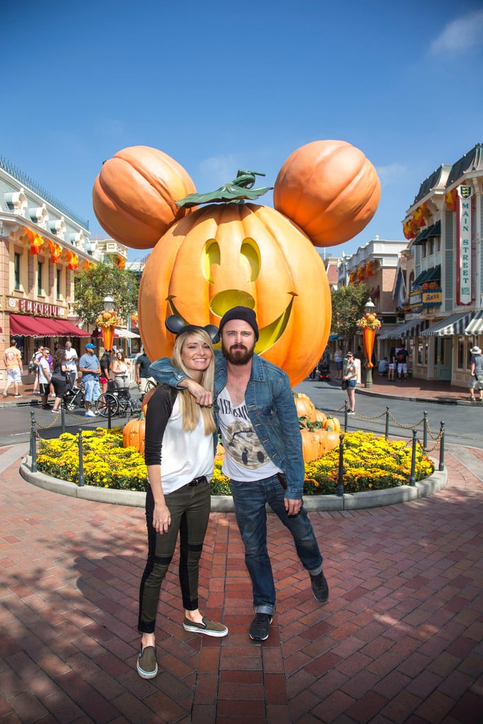 Aaron Paul and his wife, Lauren Parsekian, got into the spirit at Disneyland for their Halloween celebrations in September 2013.