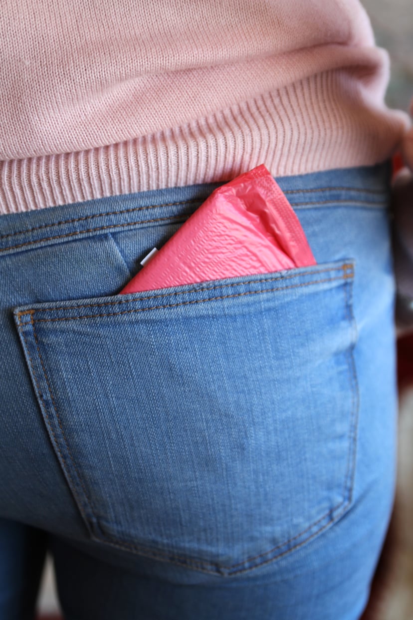 Woman With Sanitary Pad At Back Pocket