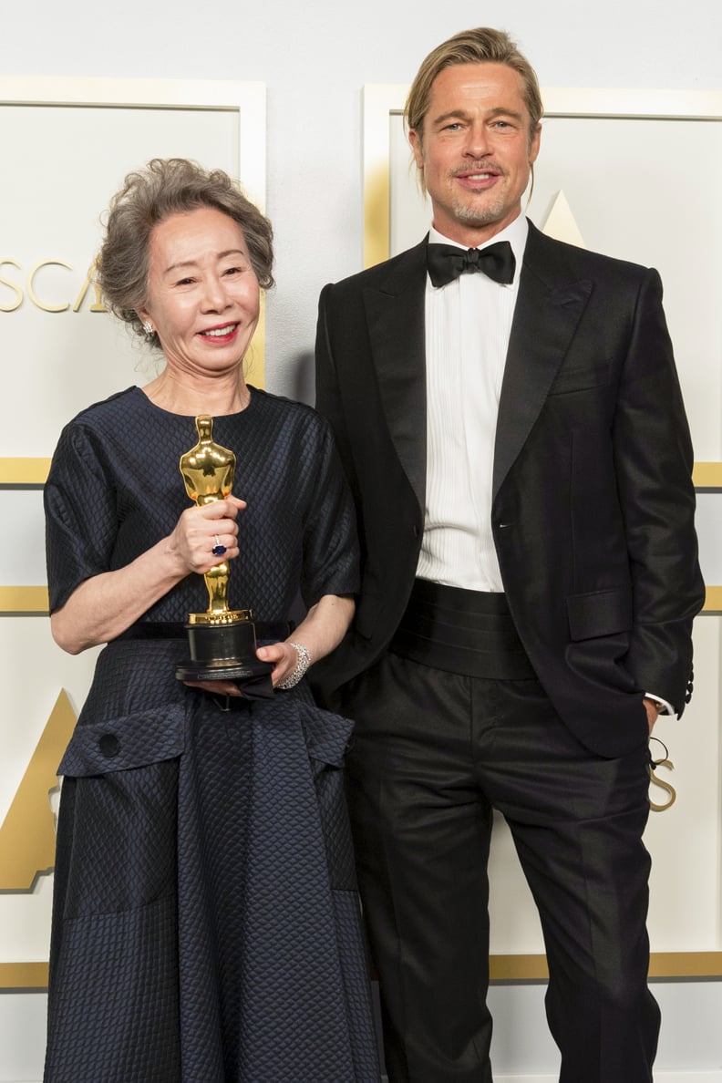 LOS ANGELES, CALIFORNIA – APRIL 25: (EDITORIAL USE ONLY) In this handout photo provided by A.M.P.A.S., Yuh-Jung Youn poses backstage with the Oscar for Actress in a Supporting Role with Brad Pitt during the 93rd Annual Academy Awards at Union Station on A