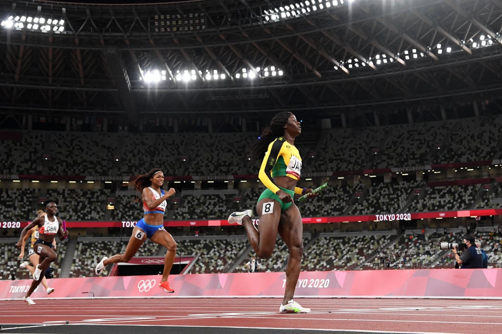 Jamaica's Shericka Jackson finishes first in the women's 4x100m relay final, followed by Team USA's Gabby Thomas and Great Britain's Daryll Neita.