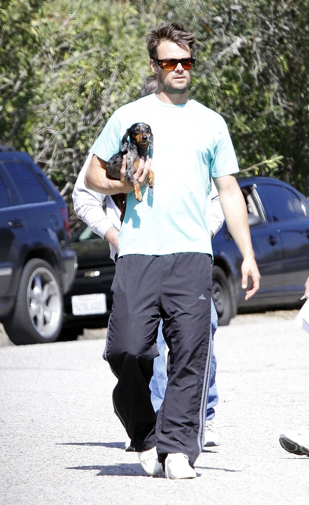 Josh Duhamel cradled his dog, Zoey, in his arms for an outing in LA in February 2009.