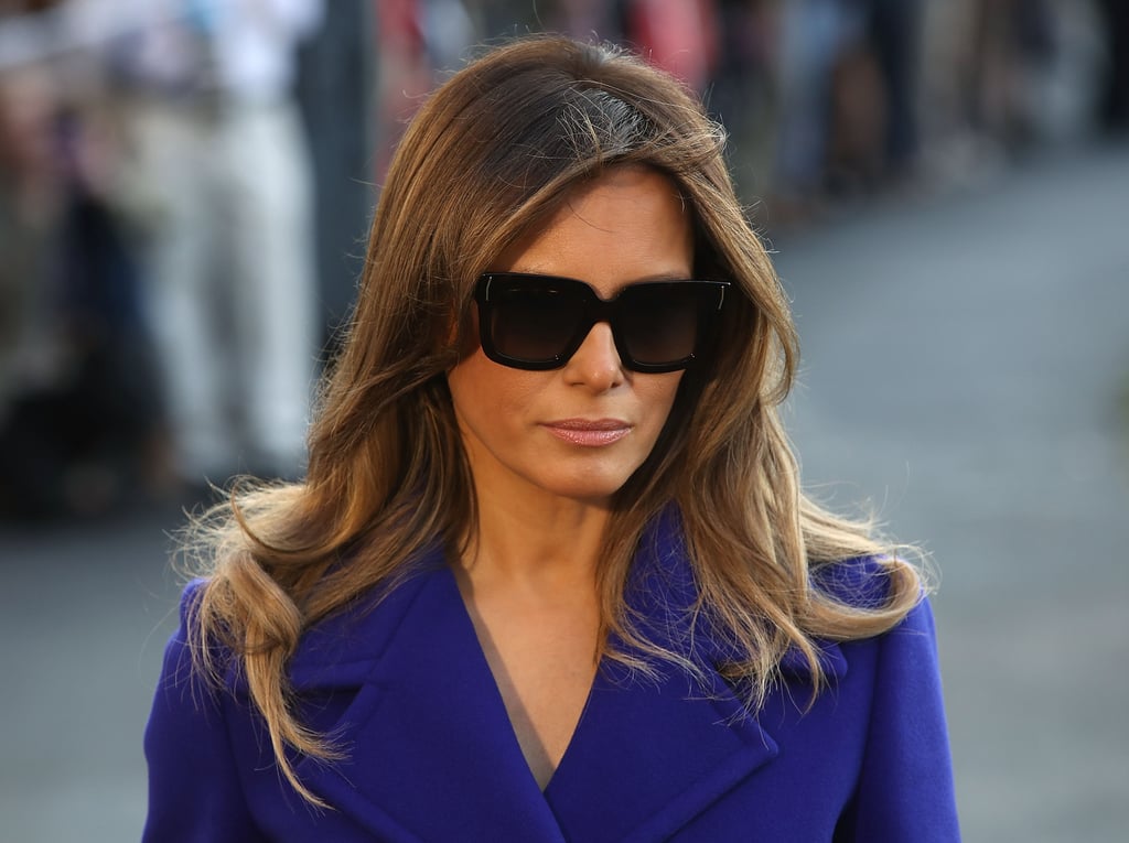 Melania departed the White House for her Asia tour in a purple Emilio Pucci coat and matching Christian Louboutin heels. She kept her accessories minimal, slipping on these dark shades.