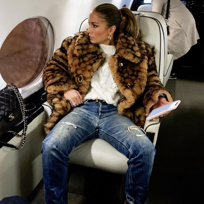 Jennifer Lopez's Coach Logo Coat on the Plane to New York