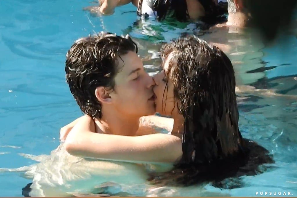 If you had any doubts that Camila Cabello and Shawn Mendes are dating, their latest PDA-filled outing should put them to rest. On Monday, the singers were spotted kissing while swimming in Miami Beach. The pair put on an affectionate display as they cuddled and shared a few laughs together. The 22-year-old Cuban star wore a white one-piece, while the 20-year-old Canadian musician ditched his shirt and showed off his muscular physique. After their PDA-filled beach out, the two shared a few more steamy kisses as they relaxed in the pool.
Camila and Shawn first met in 2014, and in 2015, they sparked dating rumors when they were spotted linking up backstage at the iHeartRadio Music Festival. They recently reignited those reports after they heated things up with their steamy "Señorita" music video and Camila split from boyfriend Matthew Hussey after a year of dating. Shawn previously denied that they're a couple, but these photos certainly imply otherwise. 

    Related:

            
            
                                    
                    
                            

            This Sexy "Señorita" Choreography Will Leave You as Sweaty as Shawn Mendes in the Music Video