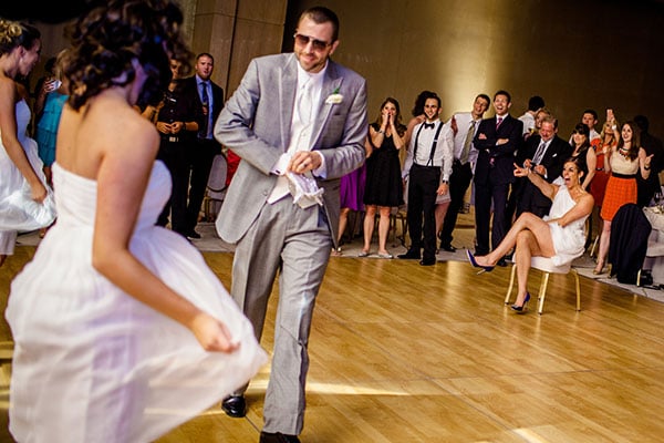 Warning: The following idea isn't for the faint of heart! The crowd went wild when this groom surprised his bride with a flash mob performance on the dance floor featuring himself and the bridal party.