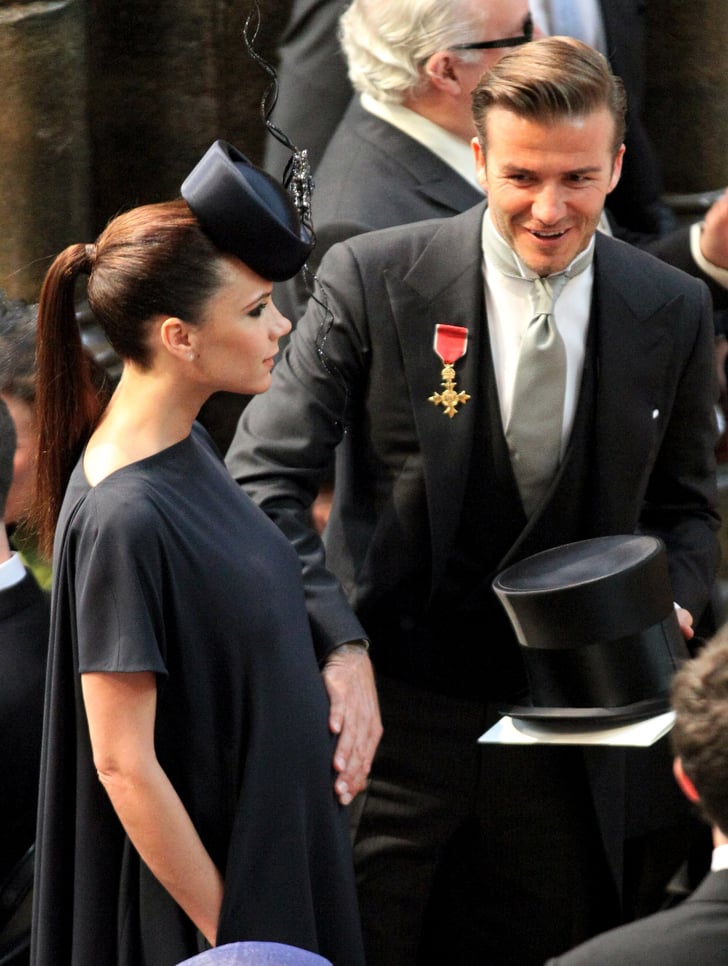 David put a hand on Victoria's pregnant belly at the royal wedding of