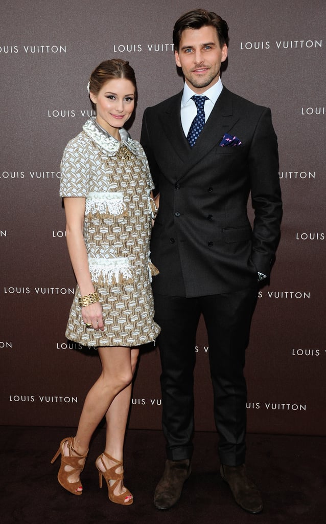 At the Louis Vuitton Maison opening in Munich, Olivia Palermo — pictured with boyfriend Johannes Huebl — mixed high with low in a metallic collared Louis Vuitton Resort '13 dress and tan suede Zara sandals.
At the Louis Vuitton Maison opening in Munich, Olivia Palermo — pictured with boyfriend Johannes Huebl — mixed high with low in a metallic collared Louis Vuitton Resort '13 dress and tan suede Zara sandals.