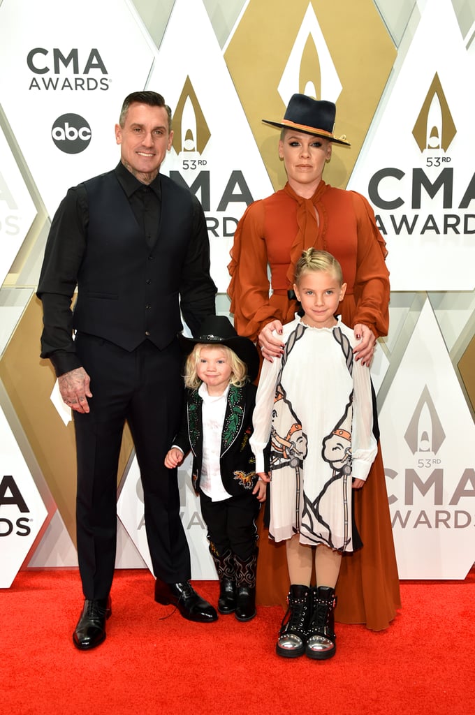 Is there a trophy for cutest coordinated outfits at the 2019 CMAs? If not, there should be, and it should go to Pink, Carey Hart, and their kids, Willow and Jameson. Just a few days after the crew showed up to celebrate at the People's Choice Awards, they walked the red carpet again for another award show on Wednesday night. The family of four was completely on-theme for the Nashville event, down to Jameson's tiny cowboy hat and boots, and Willow's darling horse-print dress. A-freakin'-dorable. 
Check out more photos from the family of four's CMAs night below. 

    Related:

            
            
                                    
                            

            Willow Hart Crashed Pink&apos;s Photo Shoot to Feed Her a Pretzel — Because Snacking Is Key