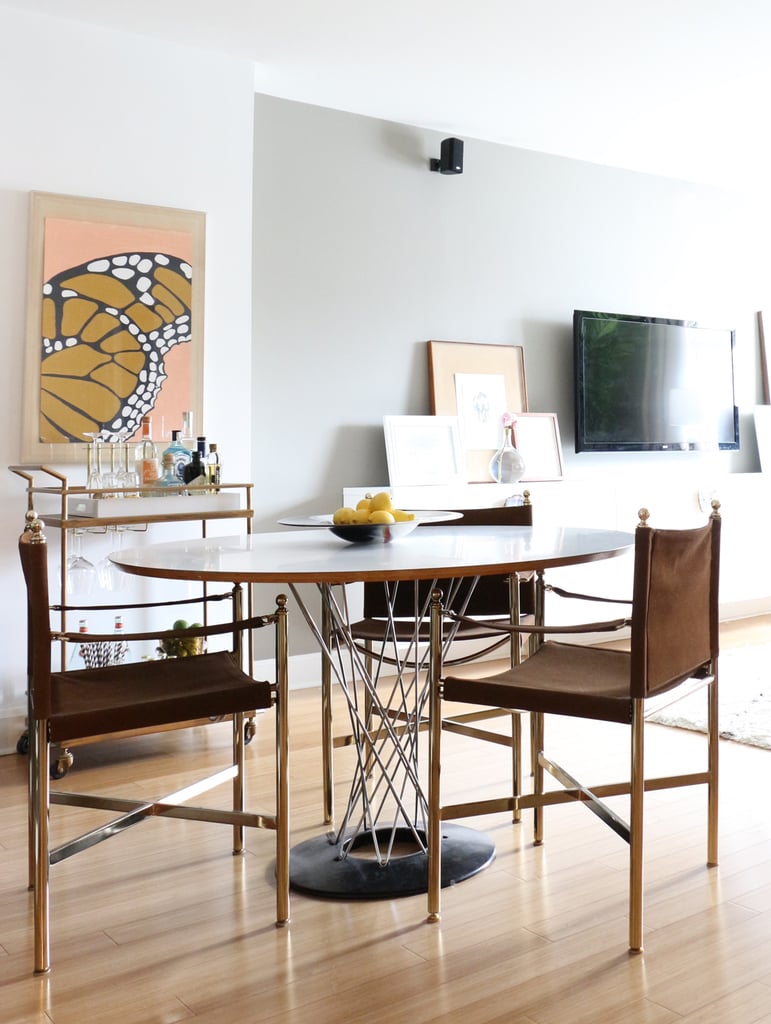 The apartment's look thoughtfully transitions from art deco to midcentury in the dining area.