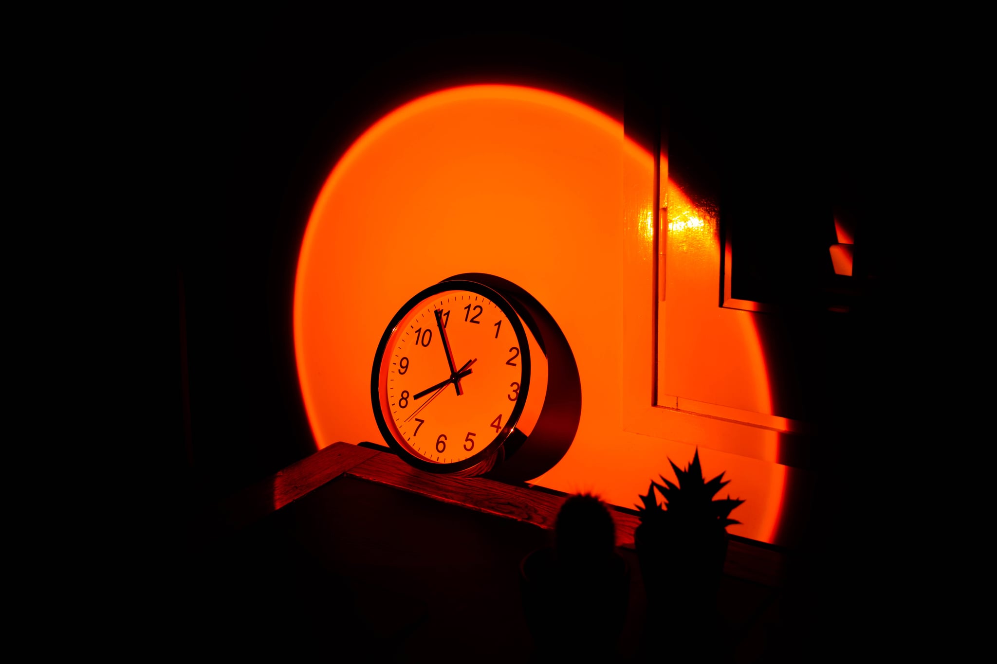 Conceptual picture of time passing with big orange sun.