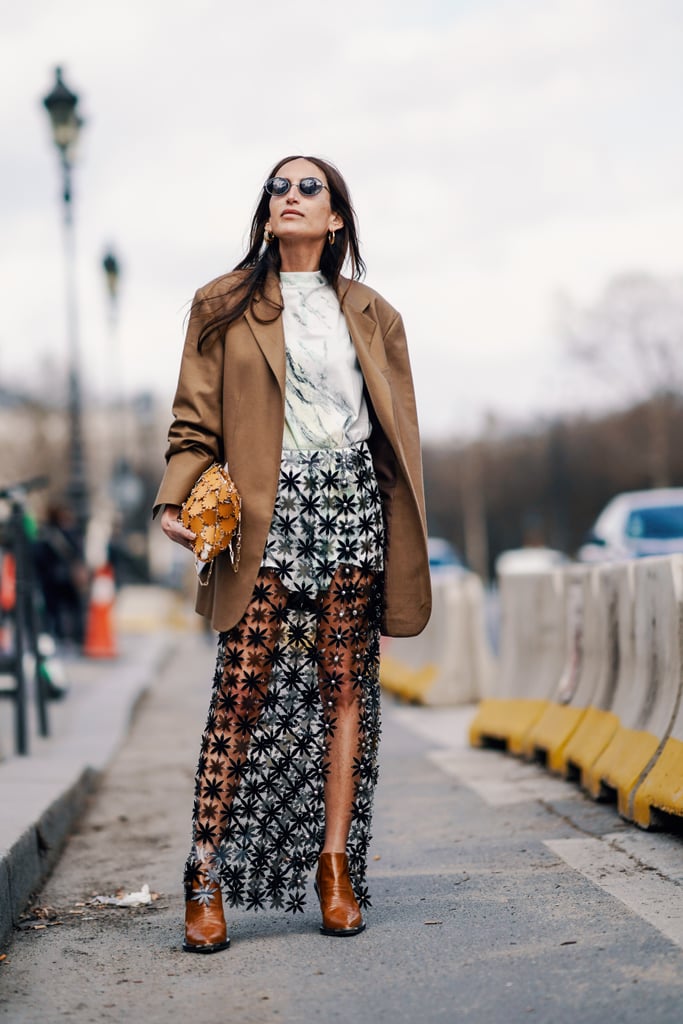 Looking for a way to show off some skin? Style your sheer skirt with a brown blazer for a put together look.