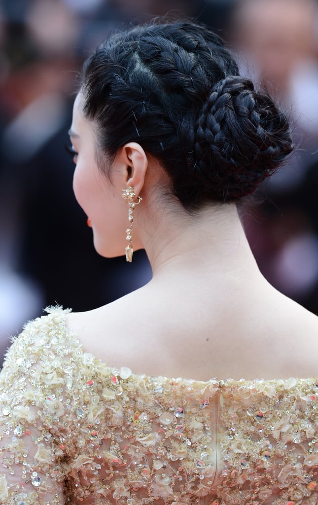 Fan Bingbing's formal up 'do at the Jeune & Jolie premiere at Cannes was a series of twists and braids that coalesced into a chic chignon.
Fan Bingbing's formal up 'do at the Jeune & Jolie premiere at Cannes was a series of twists and braids that coalesced into a chic chignon.