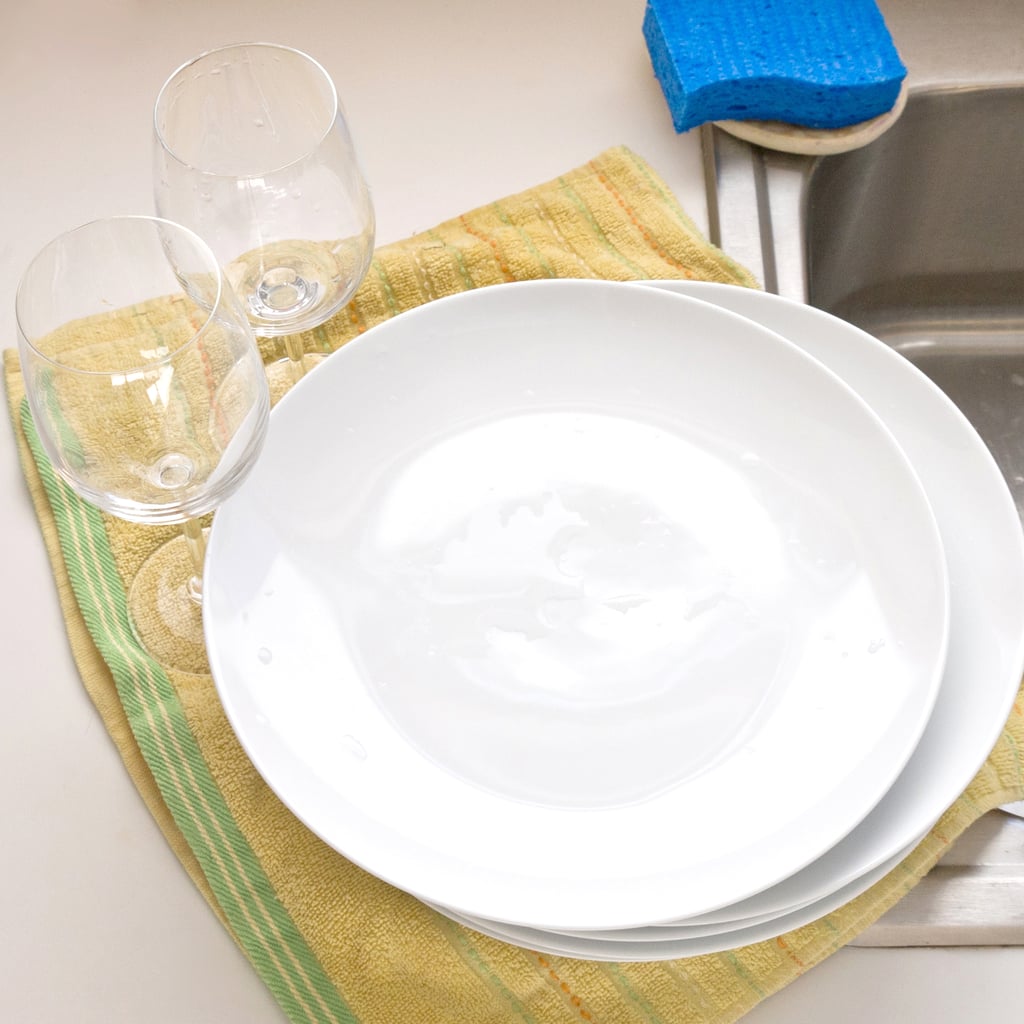 hand washing dishes in hard water