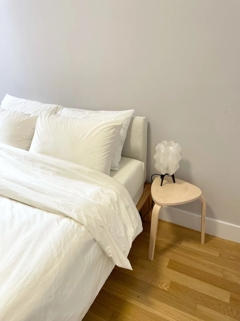 Thuma Platform Bed with PillowBoard ($1,395)
You can't go wrong with this simple and chic Thuma Platform Bed. It's a great way to mix and match different materials and textures, just like Shaffer mentioned. It's so easy to put together, too. Simply take off its removable cover and wash it whenever you need to. The upholstered headboard, known as the PillowBoard, comes in four neutral colors. It's an editor favorite for a reason — read our full review of the Thuma Platform Bed.
What we love:
"The one feature that sold me is that it's the perfect height, without being too high or too low. There is enough room to store everything from my shoes to bags and extra clothes underneath with handy organizers. " — Krista Jones, former editor, Shopping
Who it's best for:
It's an apartment-friendly option, that is best for those who want something sleek and minimal.
Who should avoid it:
This bed frame only has an upholstered headboard, which is important to keep in mind if you want the entire bed to have upholstery.
The Details: Material: Wood, linen, boucle | Sizes: Twin, twin XL, full, queen, king, and California king | Color Options: 4 linen colors, 4 wool felt colors